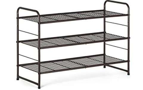 photo of a brown metal shoe rack with three shelves. 