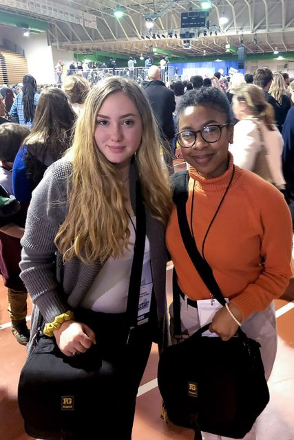 Two yearbook students at a political conference. 